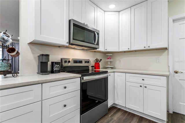 37224 Apiary Rd, Grand Island, FL 32735 - kitchen featuring stainless steel appliances and white cabinetry