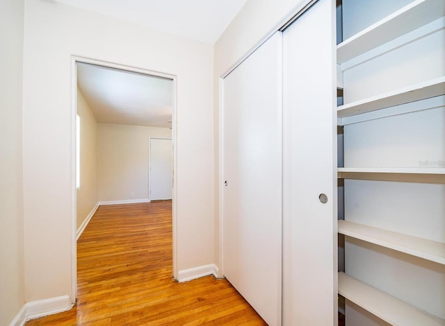 corridor featuring light hardwood / wood-style floors