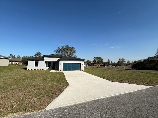 view of front of house with driveway, a front lawn, an attached garage, and stucco siding