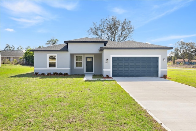 prairie-style home with a garage, stucco siding, concrete driveway, and a front yard