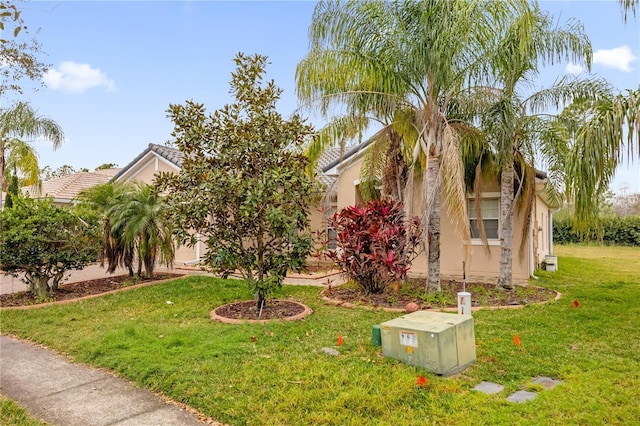 view of property exterior featuring a yard