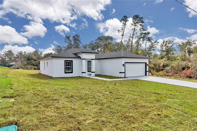 2844 SW 162nd Street Rd, Ocala, FL 34473 - view of front facade featuring a garage and a front lawn