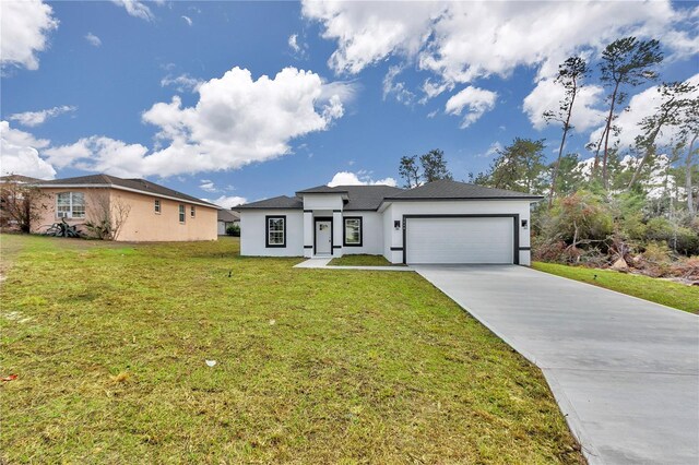 2844 SW 162nd Street Rd, Ocala, FL 34473 - view of front facade with a garage and a front lawn