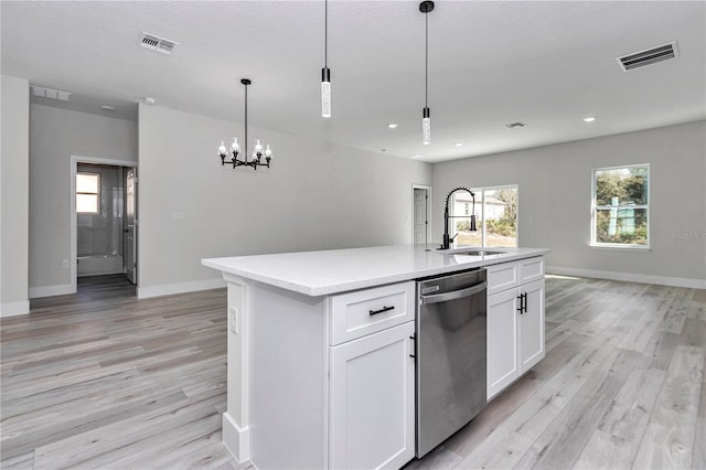 2844 SW 162nd Street Rd, Ocala, FL 34473 - kitchen featuring sink, white cabinetry, hanging light fixtures, dishwasher, and a kitchen island with sink