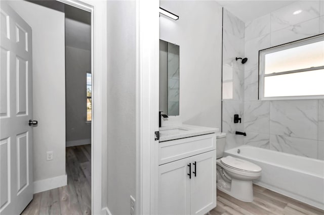 2844 SW 162nd Street Rd, Ocala, FL 34473 - full bathroom featuring vanity, tiled shower / bath combo, wood-type flooring, and toilet