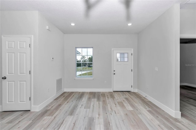 2844 SW 162nd Street Rd, Ocala, FL 34473 - foyer featuring a textured ceiling and light hardwood / wood-style floors