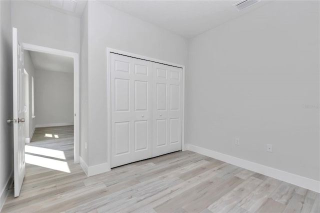 2844 SW 162nd Street Rd, Ocala, FL 34473 - unfurnished bedroom featuring light hardwood / wood-style floors and a closet