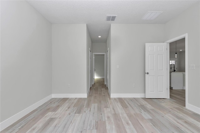 2844 SW 162nd Street Rd, Ocala, FL 34473 - interior space with light hardwood / wood-style floors and a textured ceiling