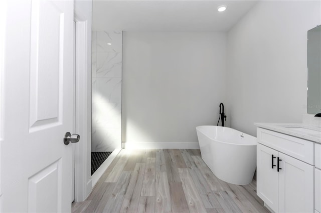 2844 SW 162nd Street Rd, Ocala, FL 34473 - bathroom featuring independent shower and bath, vanity, and hardwood / wood-style floors