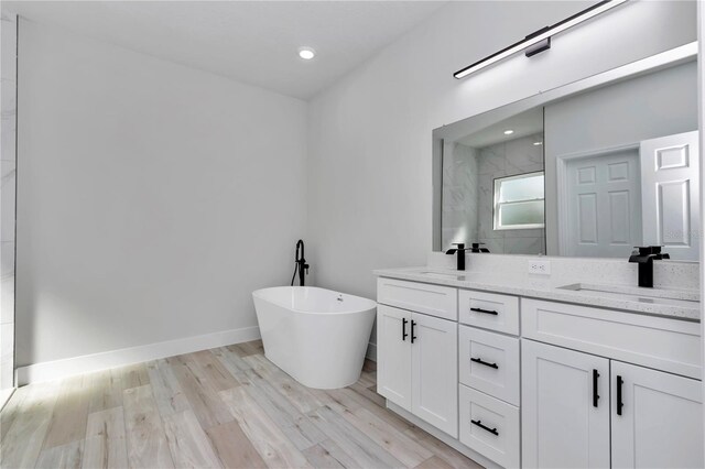 2844 SW 162nd Street Rd, Ocala, FL 34473 - bathroom with wood-type flooring, vanity, and plus walk in shower