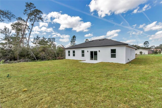 2844 SW 162nd Street Rd, Ocala, FL 34473 - back of house featuring a yard