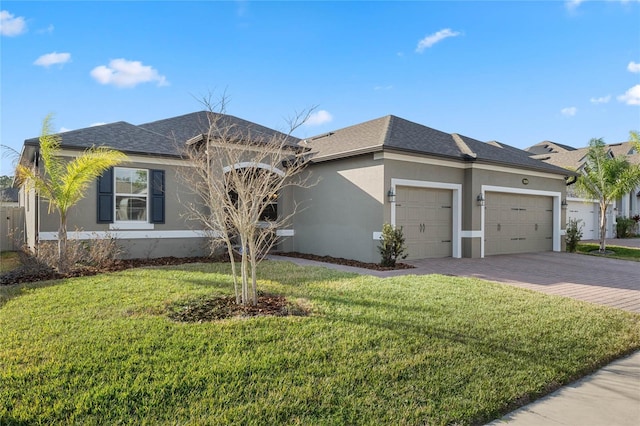 view of front of property with a garage and a front yard