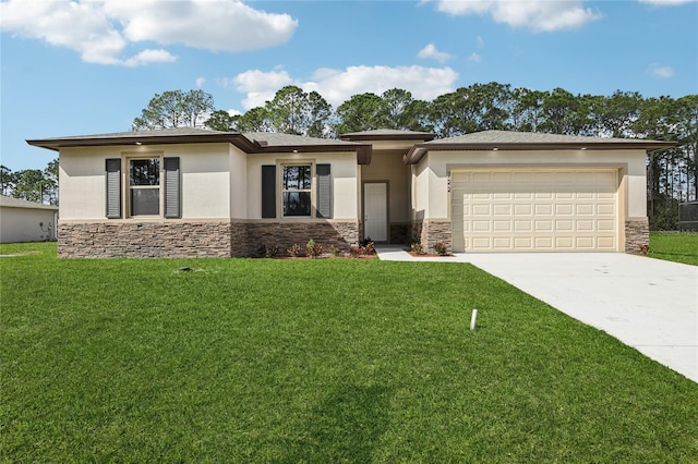 prairie-style house featuring a garage and a front lawn