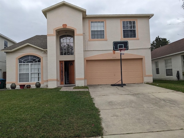 view of front of home featuring a garage and a front yard