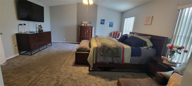 carpeted bedroom featuring lofted ceiling