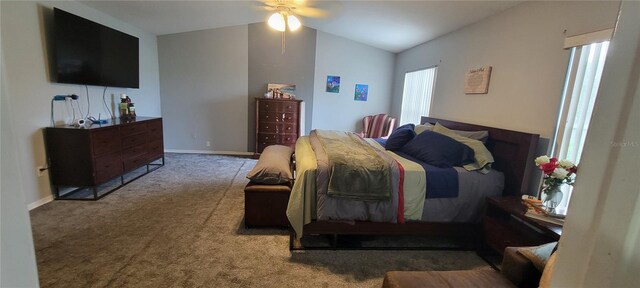 bedroom with vaulted ceiling, ceiling fan, and carpet