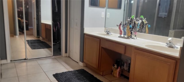 bathroom featuring tile patterned flooring and vanity