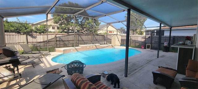 view of swimming pool featuring a lanai, a patio, and pool water feature