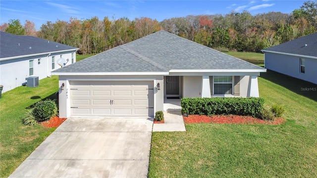 ranch-style house featuring central AC, roof with shingles, concrete driveway, an attached garage, and a front yard