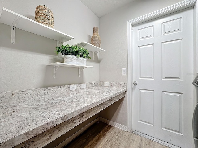 laundry room featuring laundry area and wood finished floors