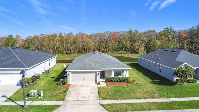 drone / aerial view featuring a wooded view