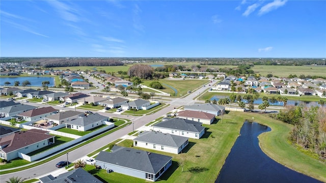 birds eye view of property with a residential view and a water view