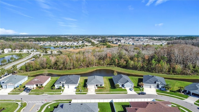 bird's eye view featuring a residential view and a water view