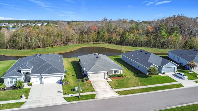 aerial view featuring a view of trees and a water view