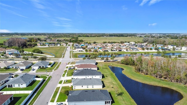 bird's eye view with a residential view and a water view