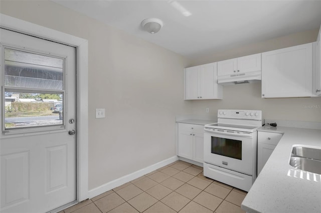 kitchen featuring white cabinetry, light tile patterned floors, white electric range, and sink