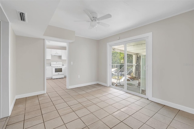 empty room featuring light tile patterned flooring and ceiling fan