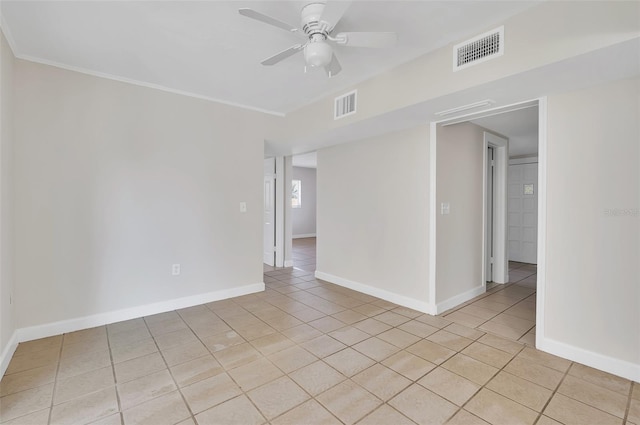 tiled spare room with crown molding and ceiling fan