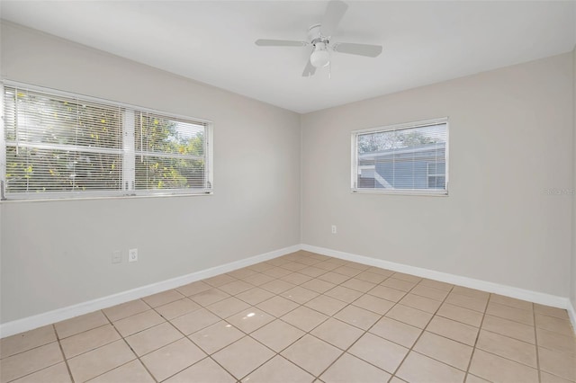 empty room with a healthy amount of sunlight and ceiling fan