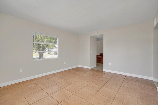 spare room featuring light tile patterned floors