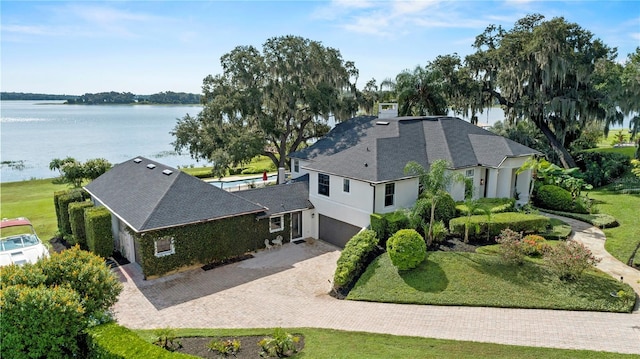 birds eye view of property featuring a water view