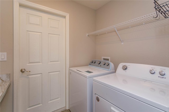 washroom with washer and clothes dryer