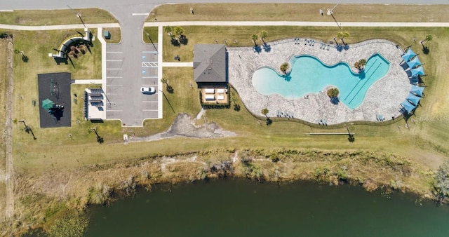 birds eye view of property with a water view