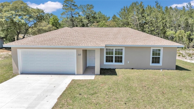 ranch-style house featuring a garage and a front lawn