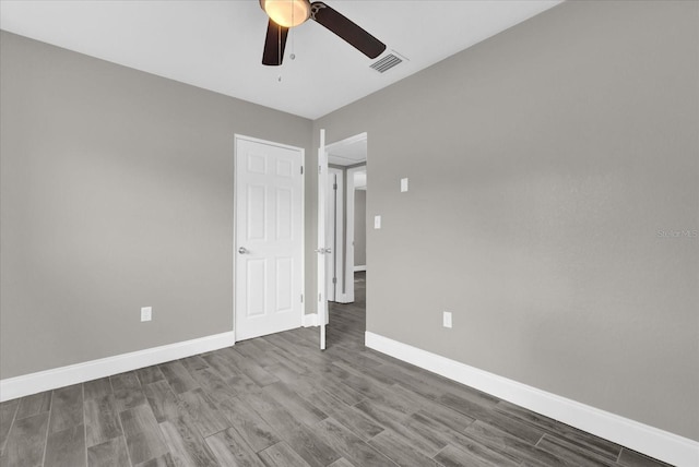 unfurnished bedroom with hardwood / wood-style floors and ceiling fan