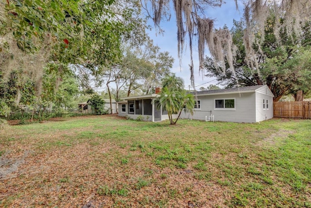 view of yard with a sunroom