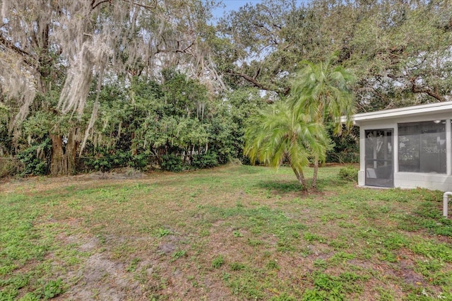 view of yard with a sunroom