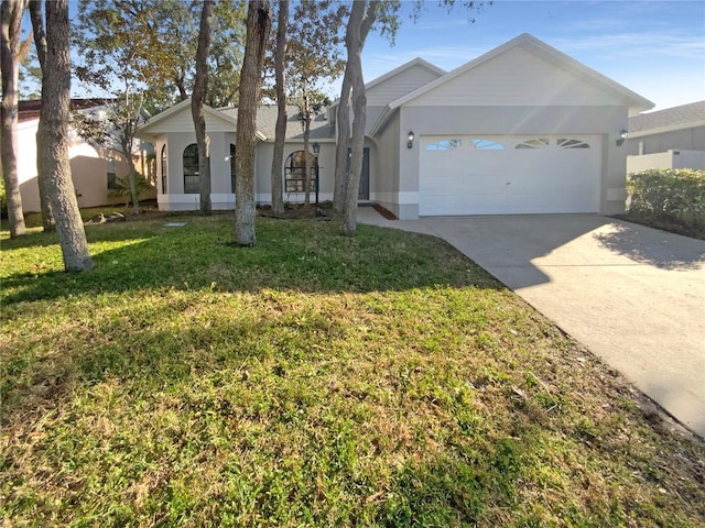 ranch-style home with a garage and a front yard