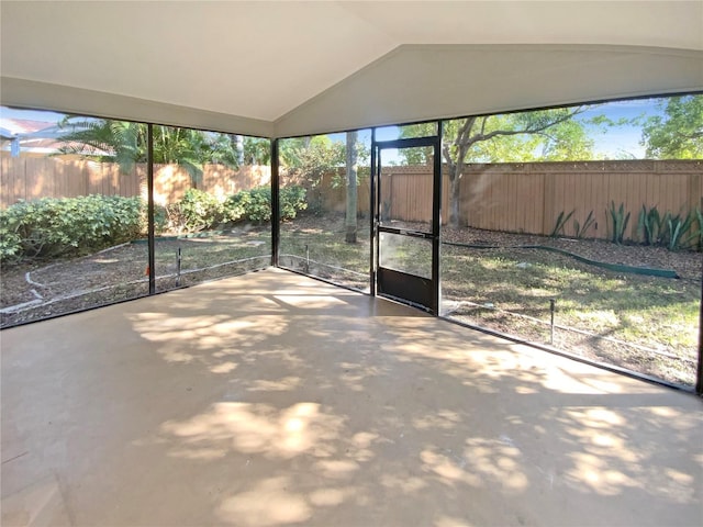 unfurnished sunroom with vaulted ceiling