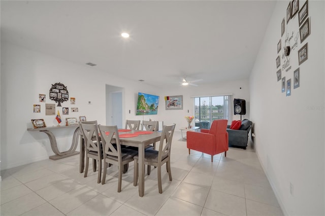 tiled dining area featuring ceiling fan