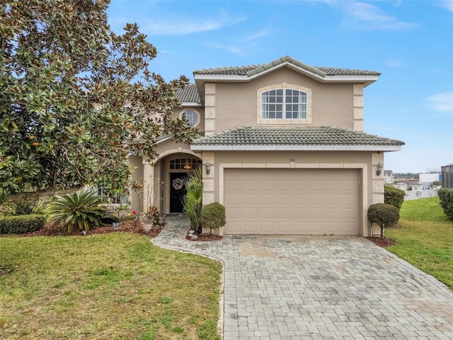 front facade with a garage and a front lawn