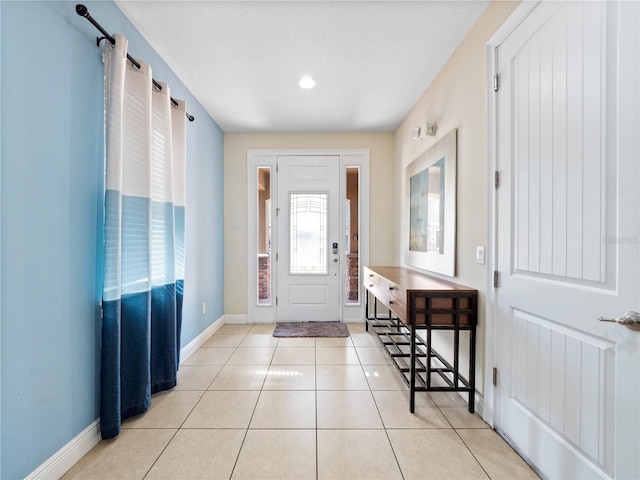 entrance foyer featuring light tile patterned flooring