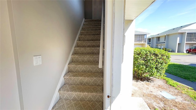 4448 Pinebark Ave Unit 56-1, Orlando, FL 32811 - stairs featuring baseboards and carpet flooring