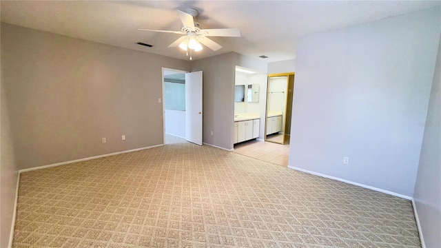 4448 Pinebark Ave Unit 56-1, Orlando, FL 32811 - empty room with ceiling fan, baseboards, and light colored carpet