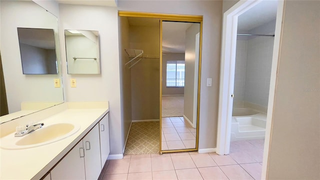 4448 Pinebark Ave Unit 56-1, Orlando, FL 32811 - full bath with tile patterned floors, vanity, baseboards, and shower / washtub combination