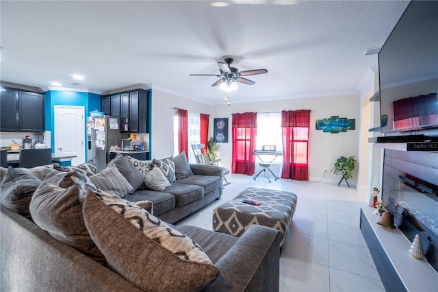 living room with crown molding, light tile patterned floors, and ceiling fan